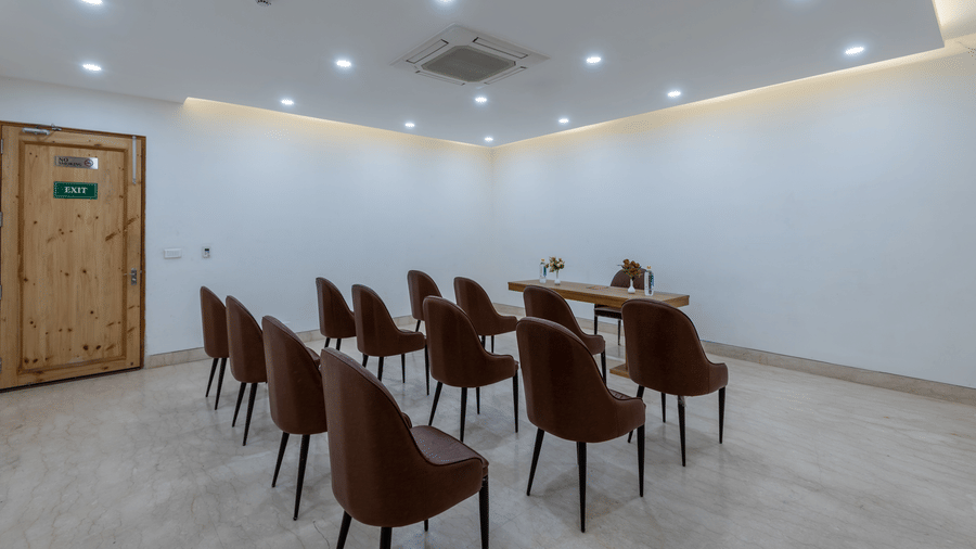 Back view of a conference room with chairs neatly arranged for a meeting or event at DLS The Classio